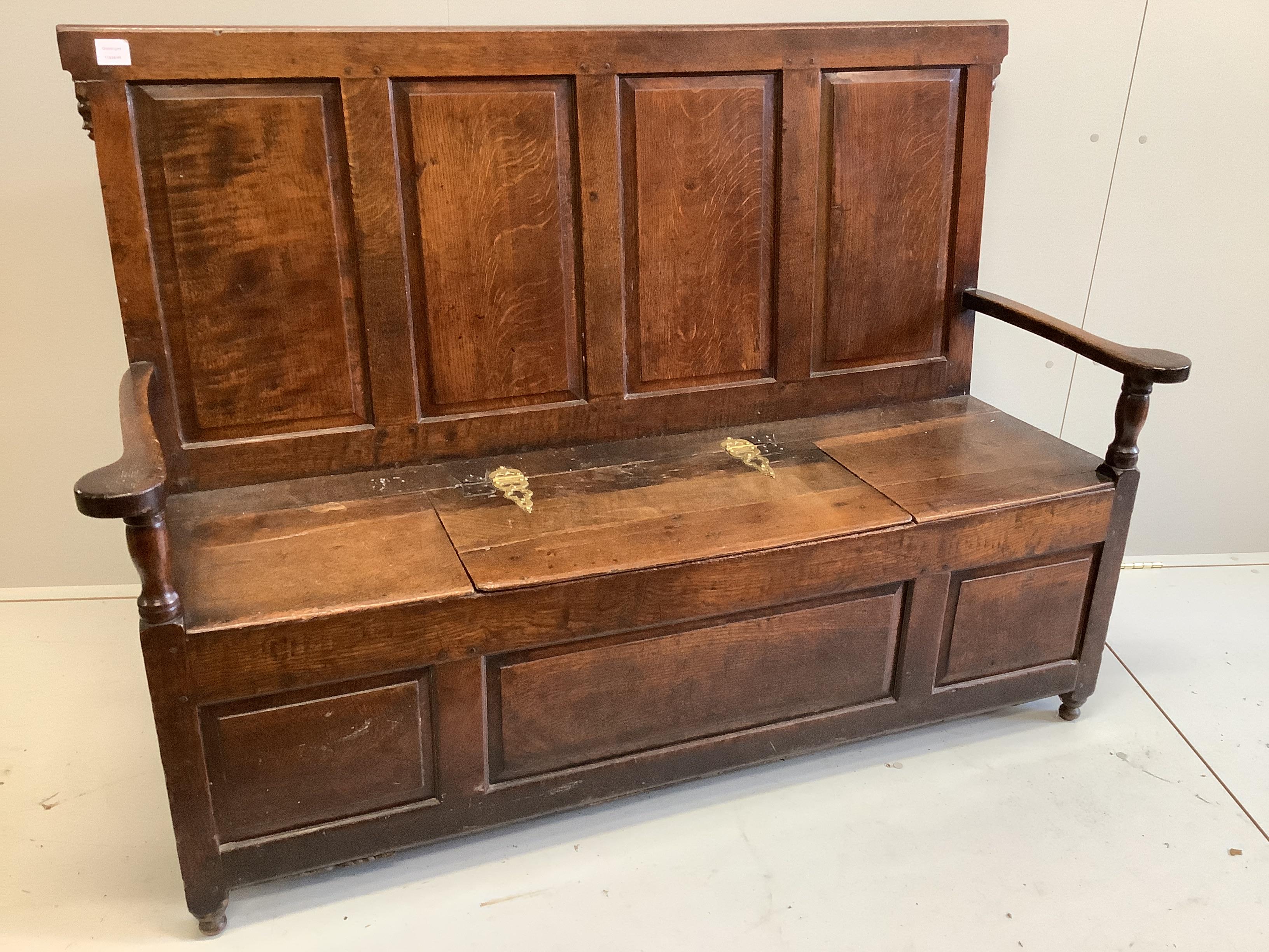 An 18th century panelled oak box seat settle, width 153cm, depth 51cm, height 108cm